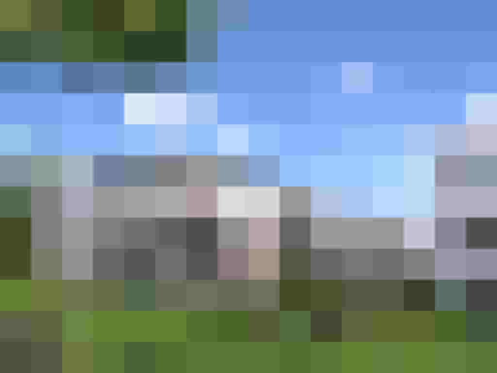 Moderne Wohnhäuser mit Balkonen in grüner Umgebung, Teil des Neubauprojekts SonnenHof.