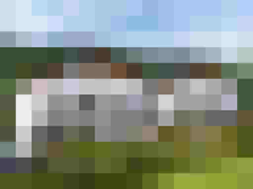 Neubauprojekt Tauernblick in Mittersill mit modernen Eigentumswohnungen und Grünflächen.